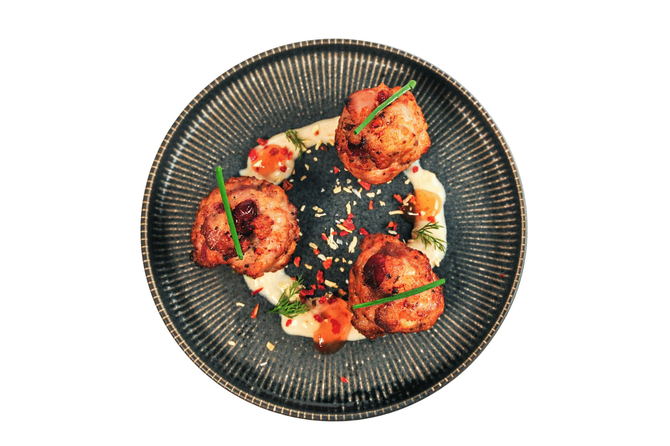 Three golden arancini balls garnished with thyme on a ceramic plate.